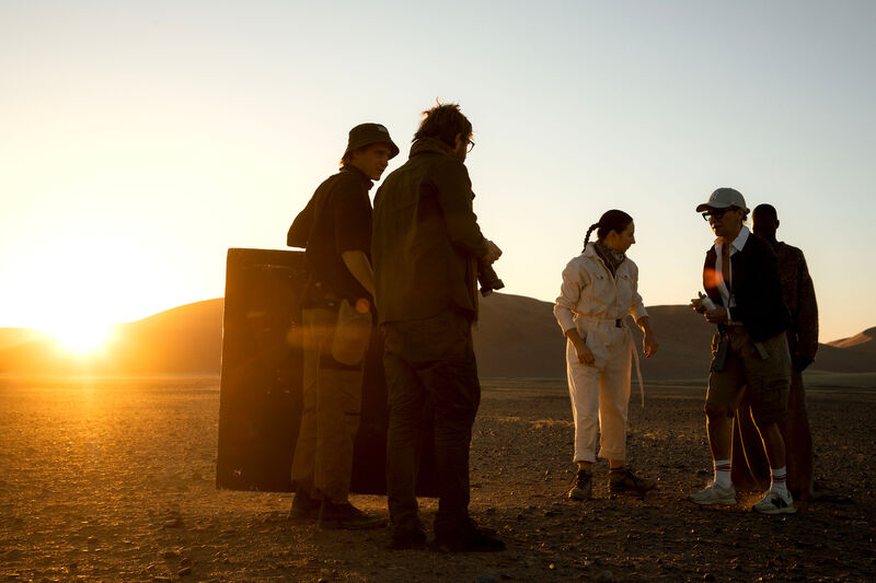 Brunello BTS — talent and dune, golden hour