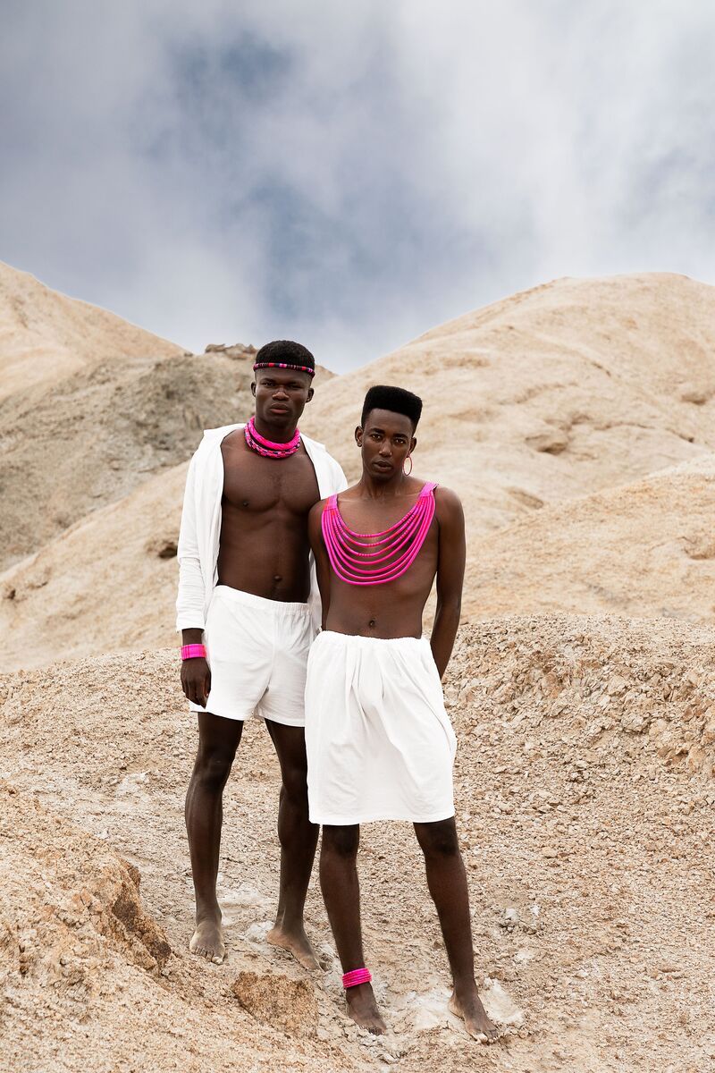 Dorob editorial — figure framed by granite outcrop
