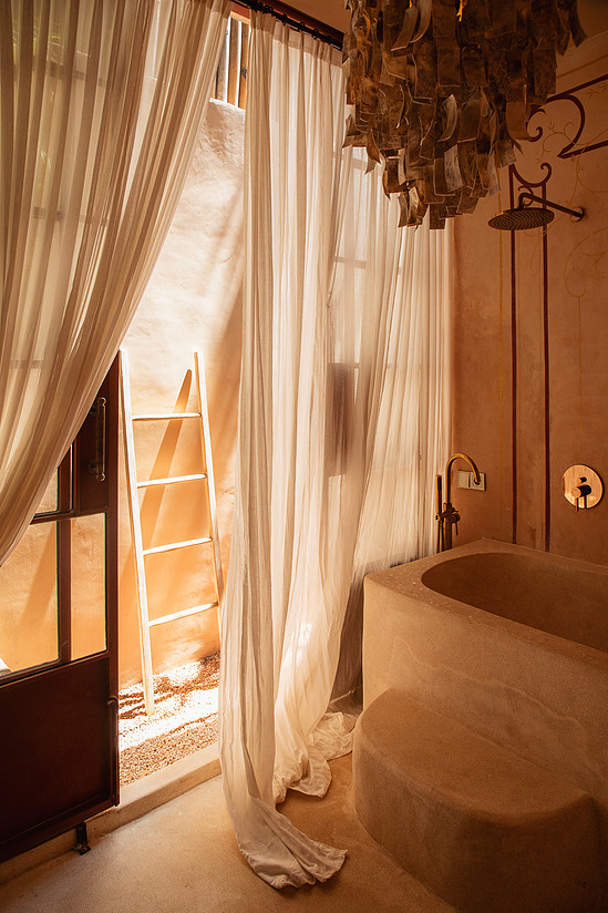 Riad rooftop, terracotta tile, dusk